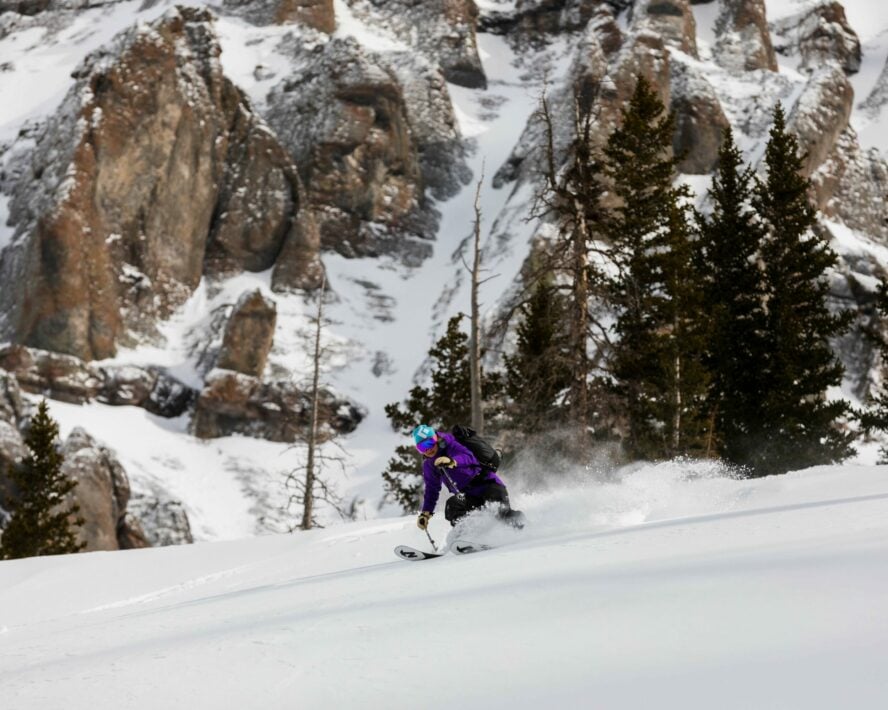 Backcountry skier on a fresh slope.