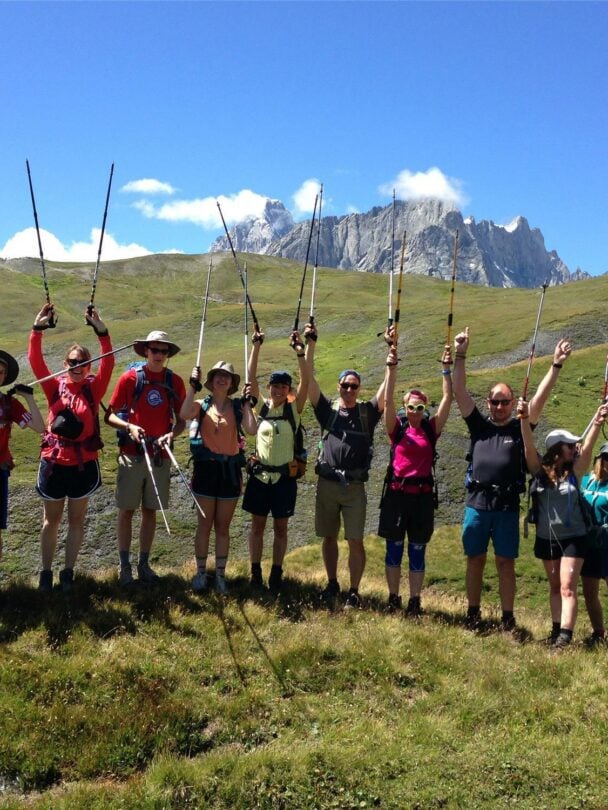 Group of happy hikers on TMB highlights