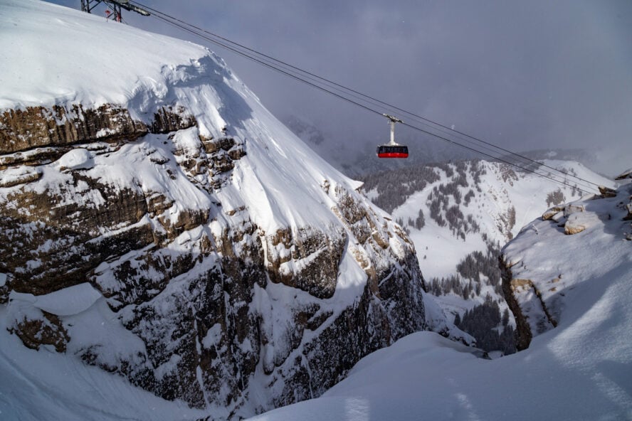 Lift running above the snow-covered Teton Mountains at Jackson Hole Resort